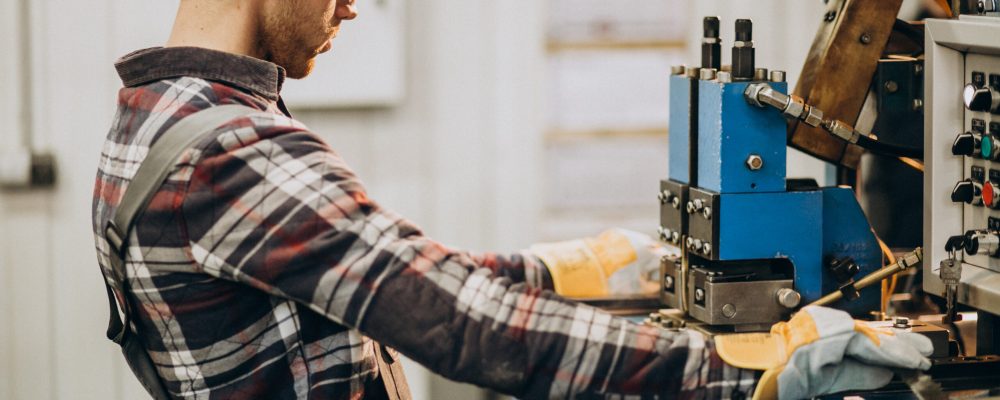 Man working on steel fatory and equipment for steel production